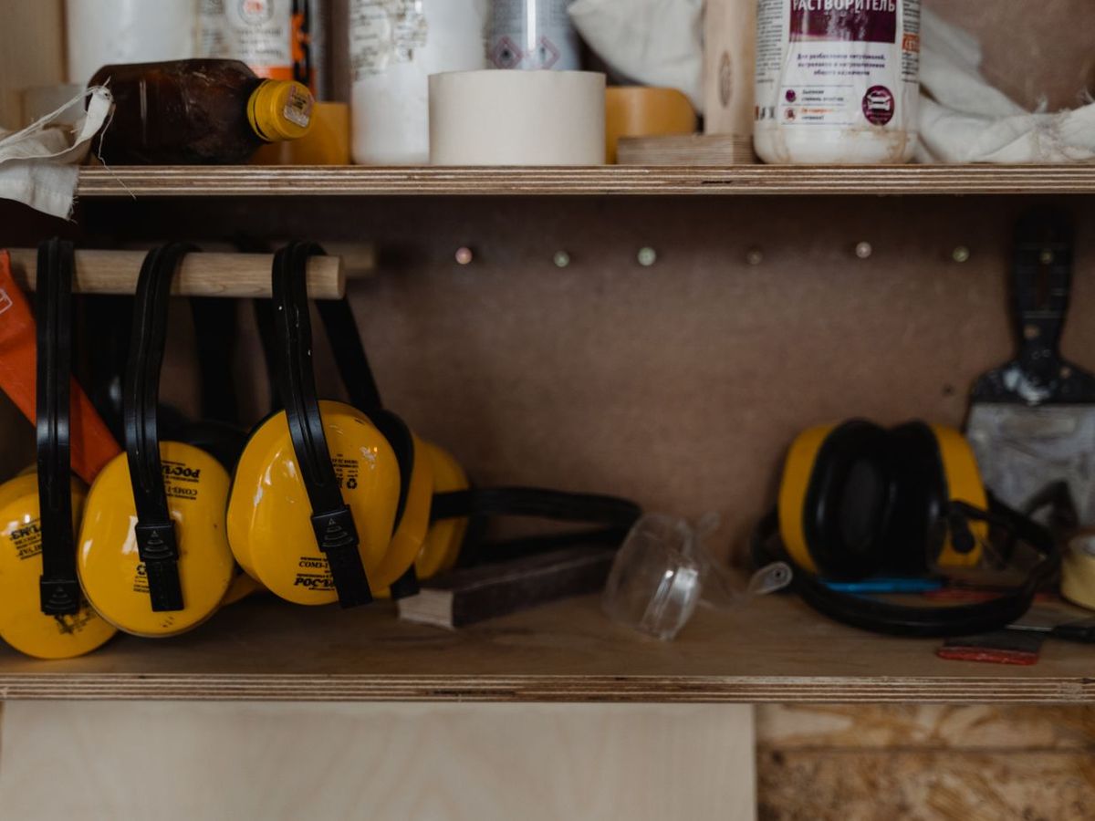 Consumables and fixing sundries stored on a workshop shelf