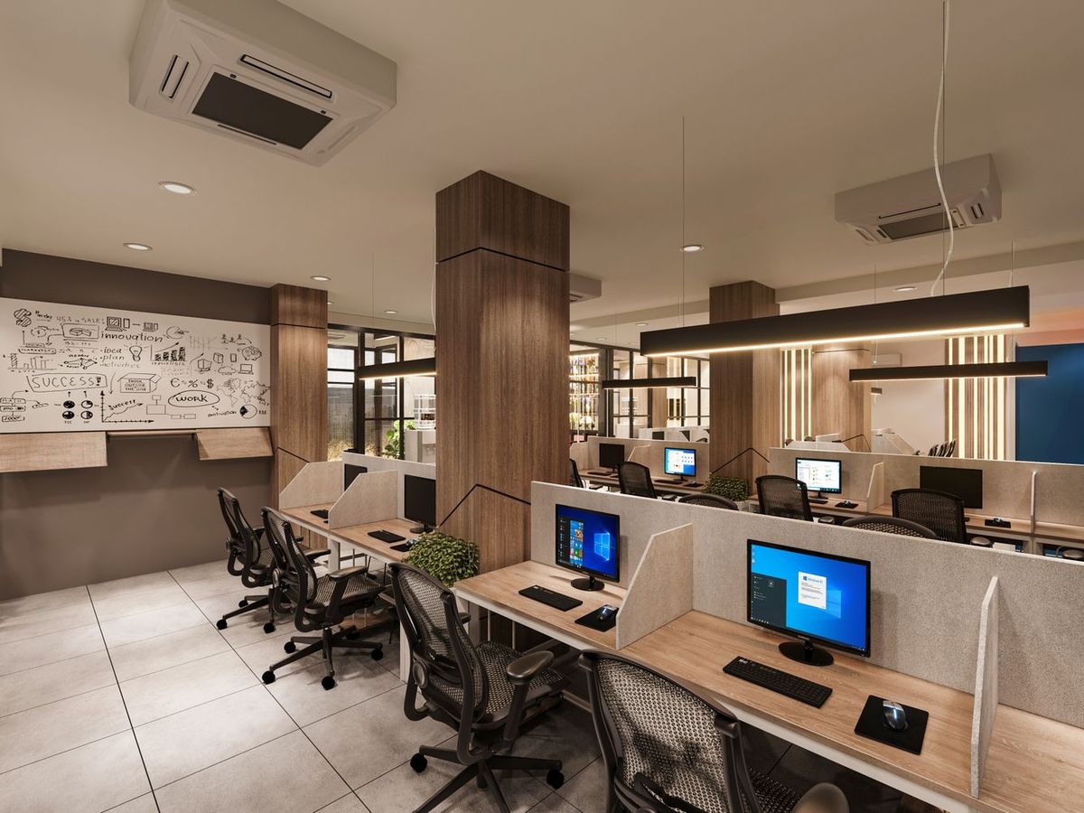 Office workstations with timber-topped desks and low partitions
