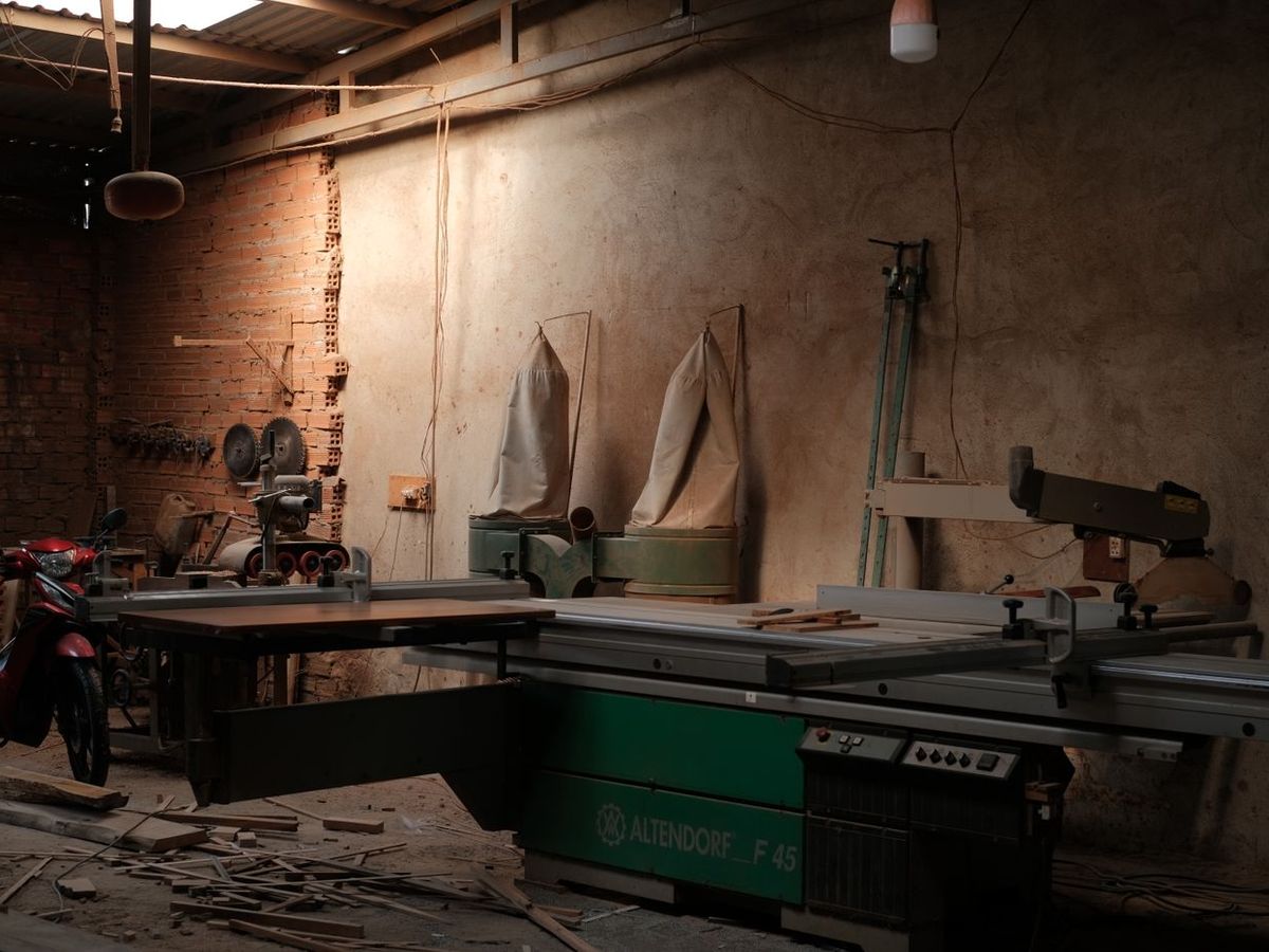 A panel saw set up in a working joinery shop mid-job
