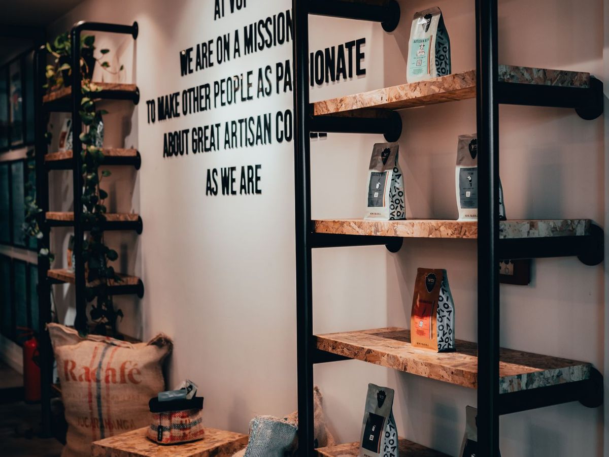 Shop wall fitted out with timber and steel display shelving