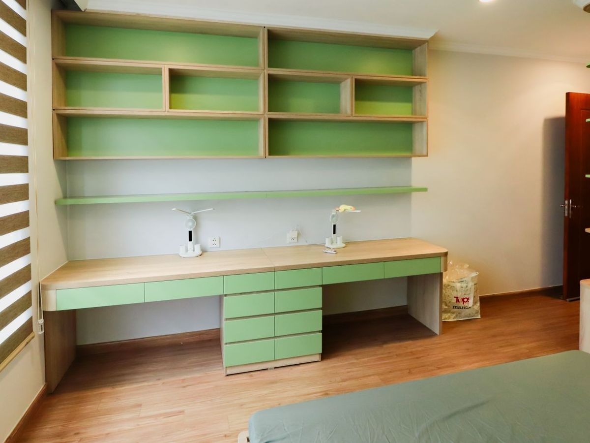Built-in study desk with drawer bank and overhead storage