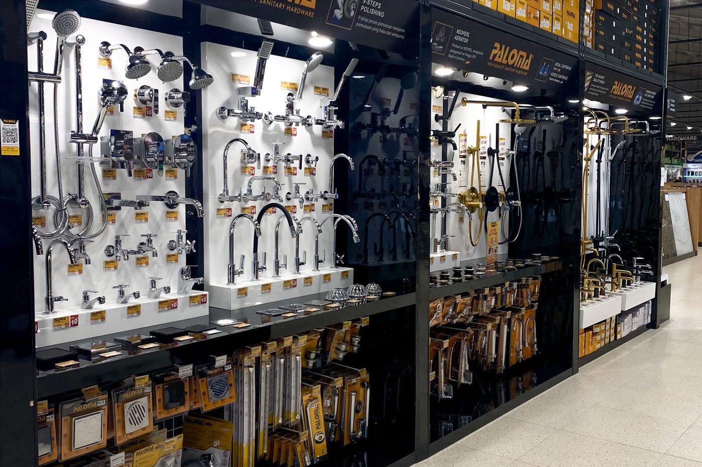 Builder hardware displayed along a shop aisle — handles, locks and fittings racked by type